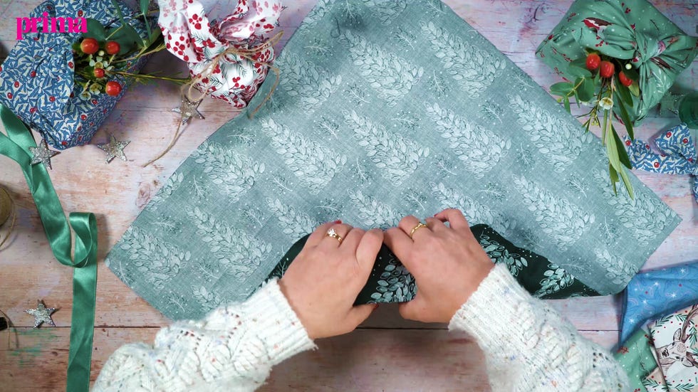 How to wrap a present using festive fabric