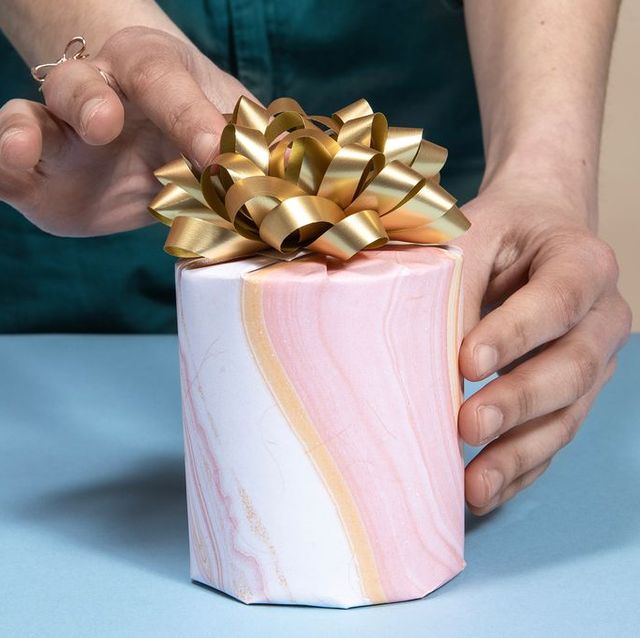 a person holding a gift box