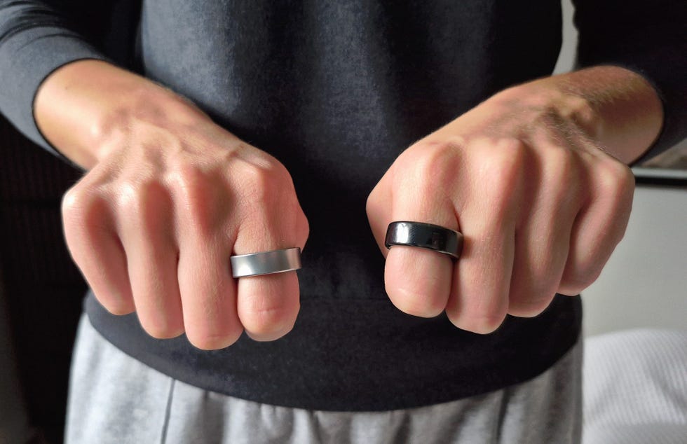 close up of two firsts wearing a ring on each hand