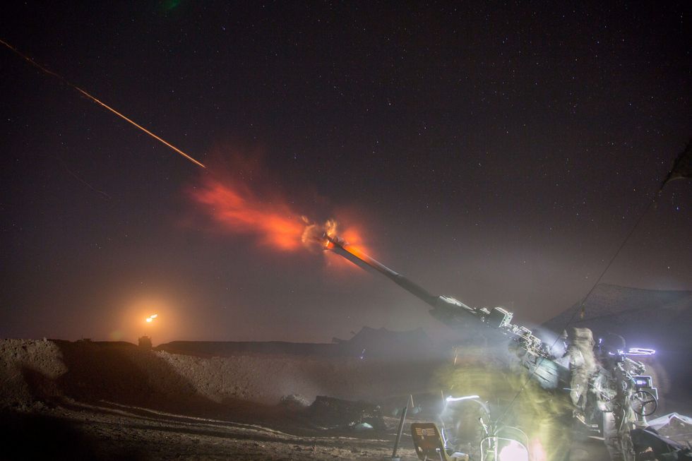 us soldiers assigned to charlie battery, 1st battalion, 320th field artillery regiment, 2nd brigade combat team, 101st airborne division conduct a night fire mission in support of the mosul offensive at platoon assembly area 14, iraq, dec 6, 2016 charlie battery conducted the fire mission in support of combined joint task force   operation inherent resolve, the global coalition to defeat isil in iraq and syria  us army photo by spc christopher brecht