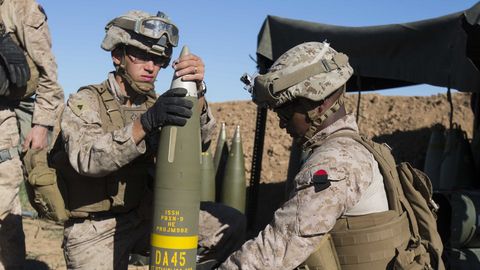 us marine corps cpl jordan crupper, an artilleryman, and sgt onesimos utey, an artillery section chief, both with task force spartan, 26th marine expeditionary unit meu, prepare an excalibur 155 mm round on fire base bell, iraq, while conducting fire missions against an islamic state of iraq and the levant isil infiltration route march 18, 2016 operation inherent resolve is an international us led coalition military operation created as part of a comprehensive strategy to degrade and defeat isil us marine corps photo by cpl andre dakisreleased
