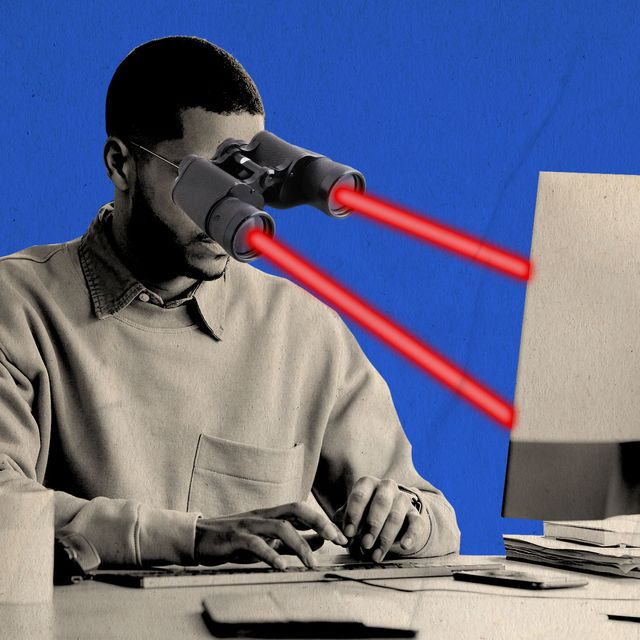 man working at a desk with laser focused eyes on his computer