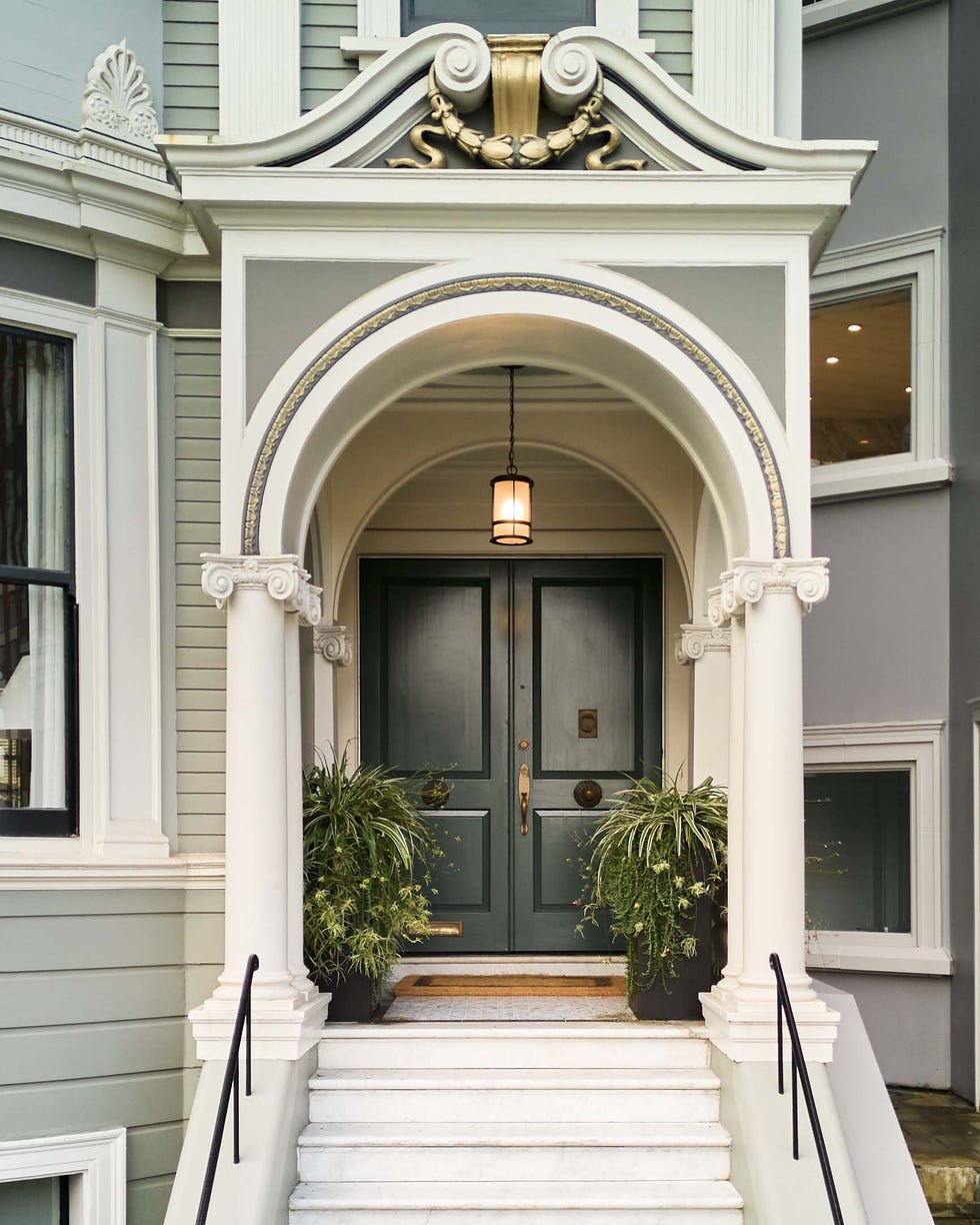 entrance featuring a double door and decorative architectural elements