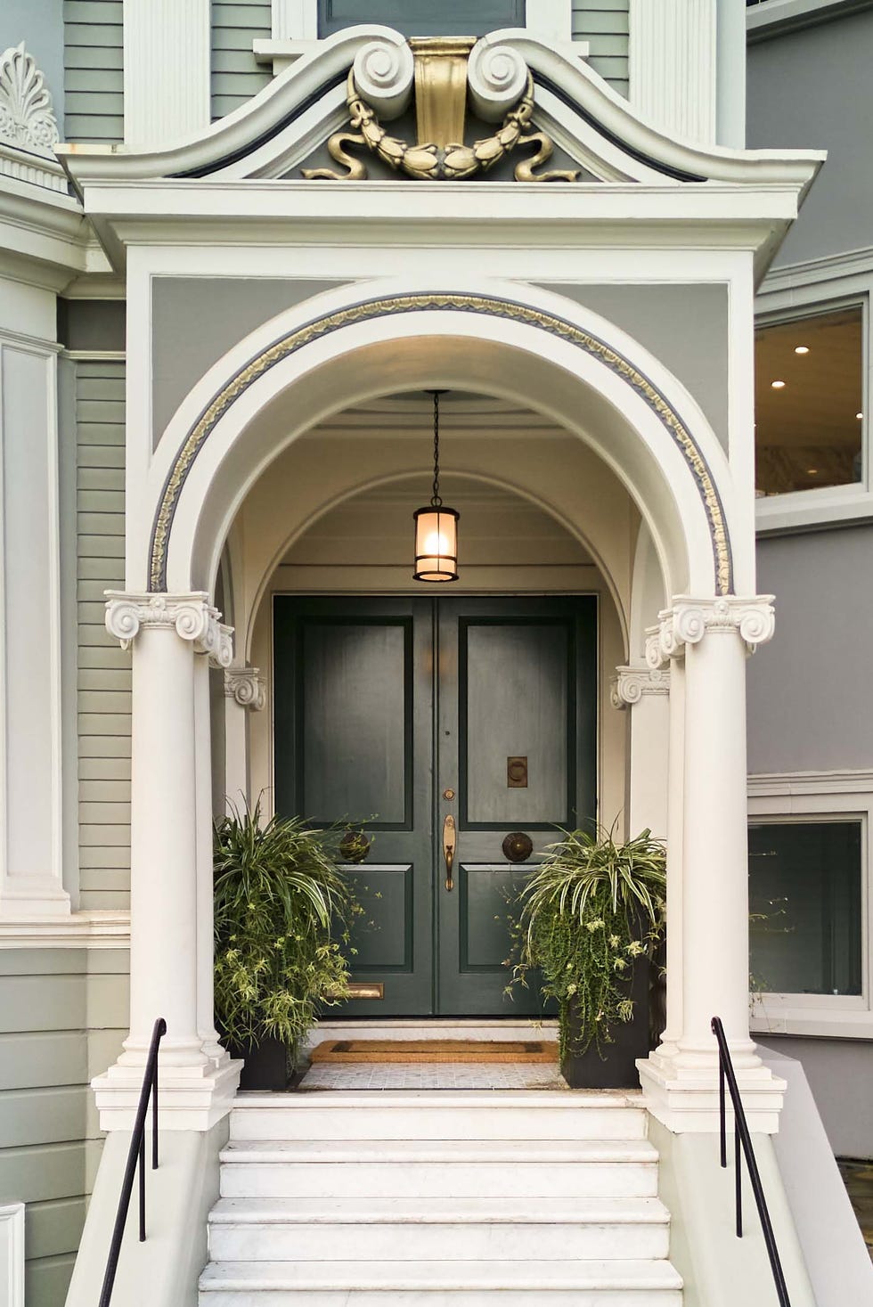 entrance featuring a double door and decorative architectural elements
