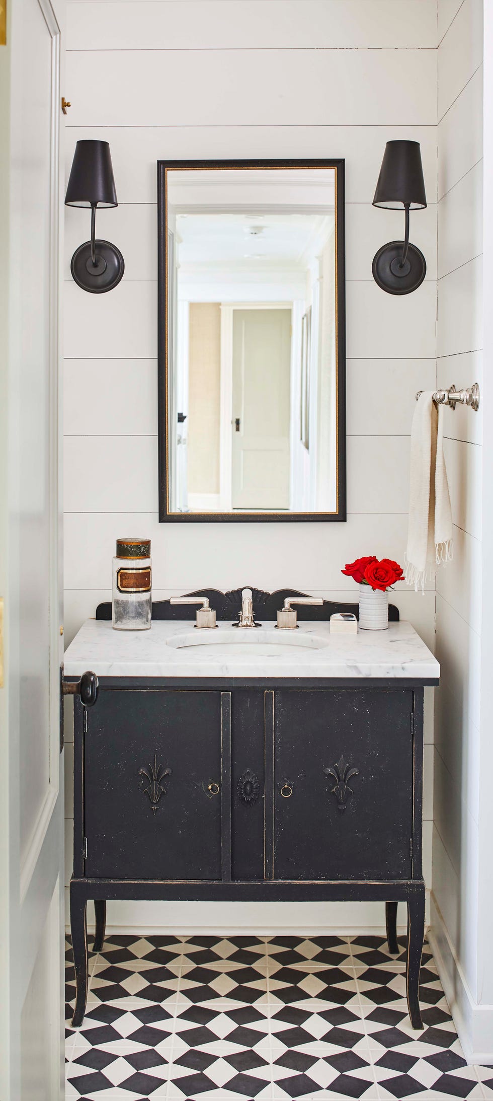 a bathroom with a mirror and a sink