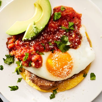 Huevos Rancheros huevos rancheros topped with avocado, cotija and cilantro