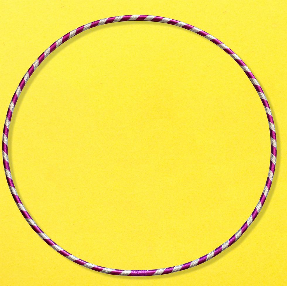 striped hula hoop on yellow background