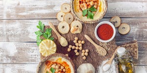 Hummus topped with whole chickpeas and olive oil.