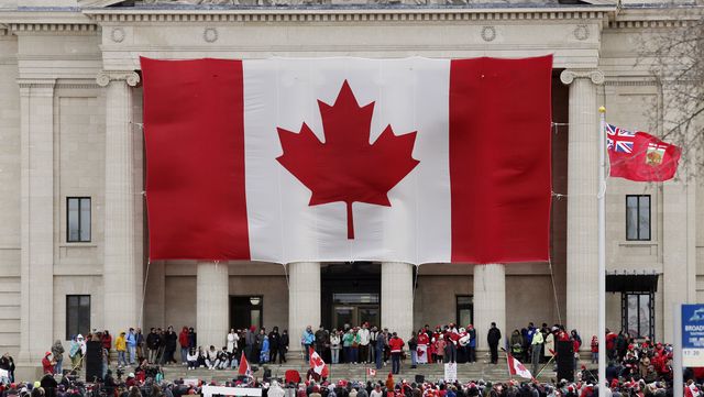 hundreds of people rally against u.s tarrifs and threats of...