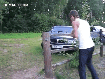 hurdling over a fence 