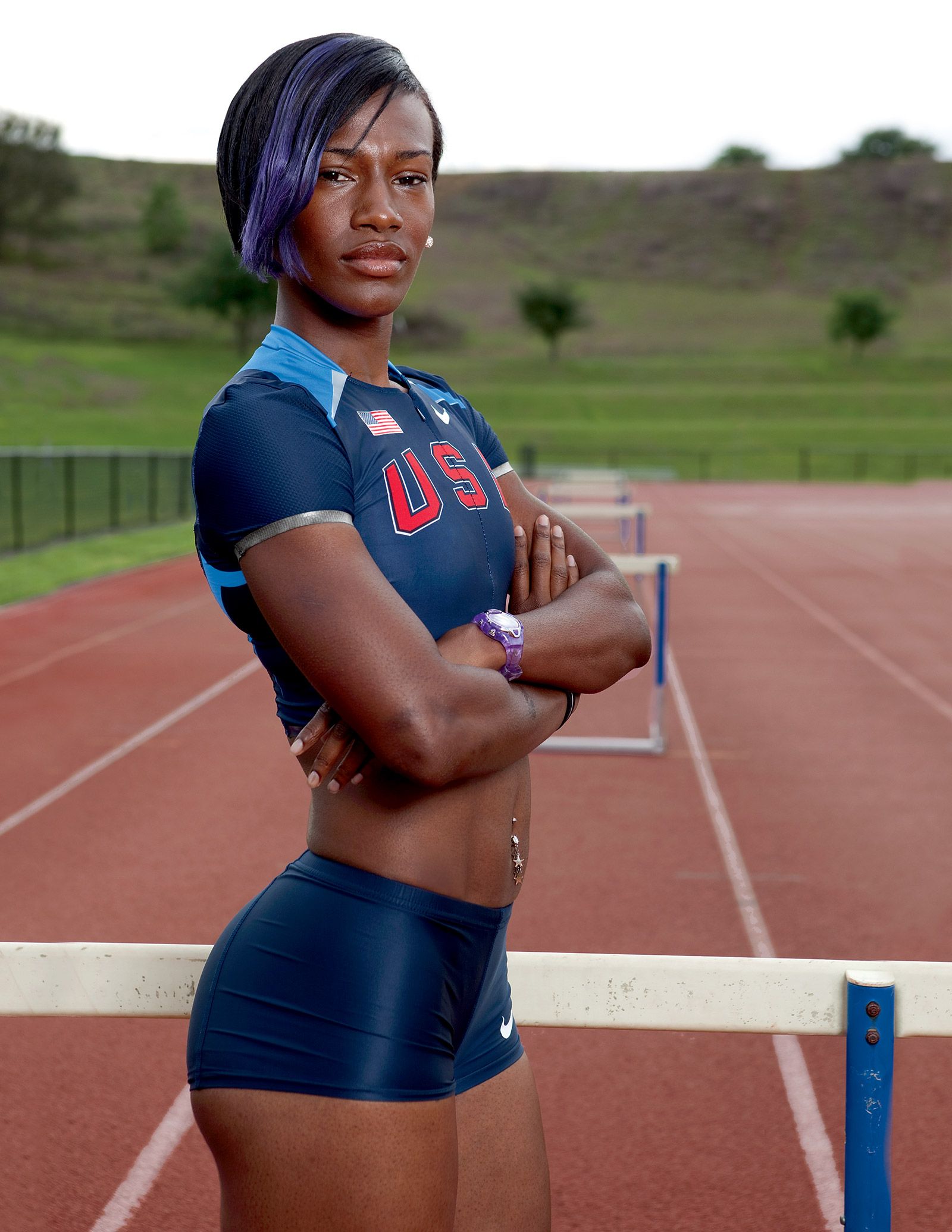 Premium Photo  African american female athlete feels happy after running long  distance on track at sports ground