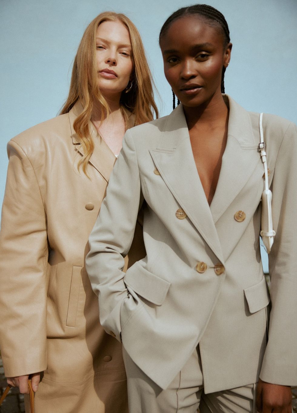 hurr rental flex featuring two models wearing beige oversized suits