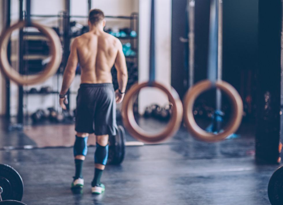 young athlete preparing for exercise deadlift in gym professional athlete wearing sports clothing