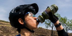 rosael torres drinking from her water bottle after a mtn bike ride in 2023