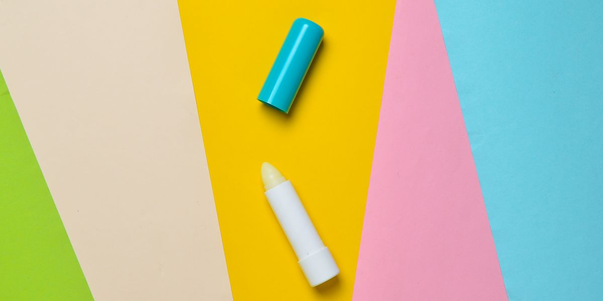 hygienic lip balm on a colored paper background, minimalism, top view