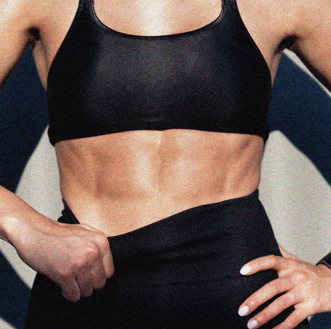 a womans torso with visible ab muscles