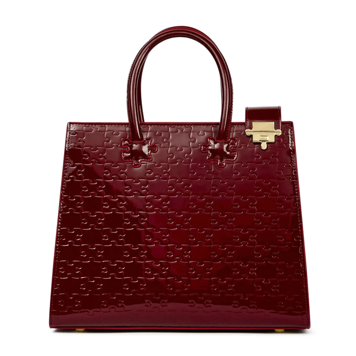 https://hips.hearstapps.com/hmg-prod/images/ibukun-tote-patent-leather-oxblood-1-65959789acbb1.png?crop=1xw:1xh;center,top&resize=980:*