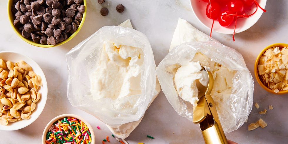 ice cream in a bag with cherries, sprinkles, and toppings