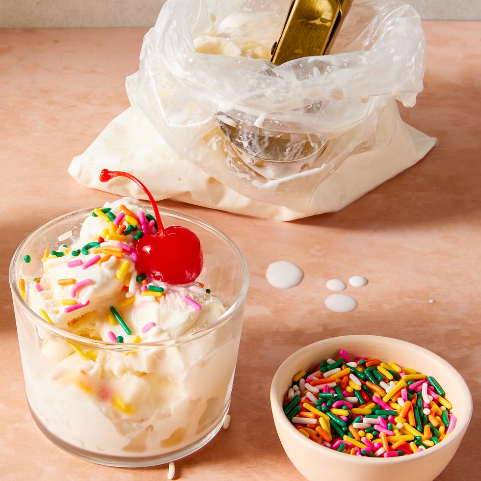 ice cream in a bag with cherries, sprinkles, and toppings