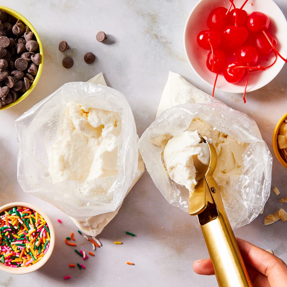 ice cream in a bag with cherries, sprinkles, and toppings