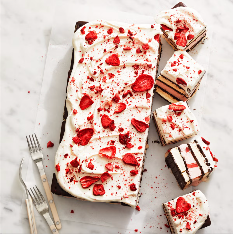 ice cream sandwich cake topped with whipped cream and freeze dried strawberries