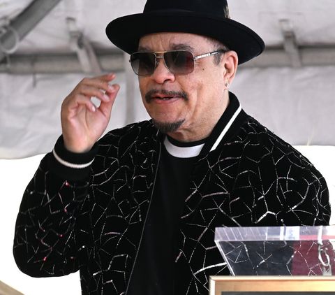 ice t wearing a black shirt and jacket, black hat, and sunglasses