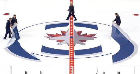 winnipeg jets install logo and lines in mts center ice