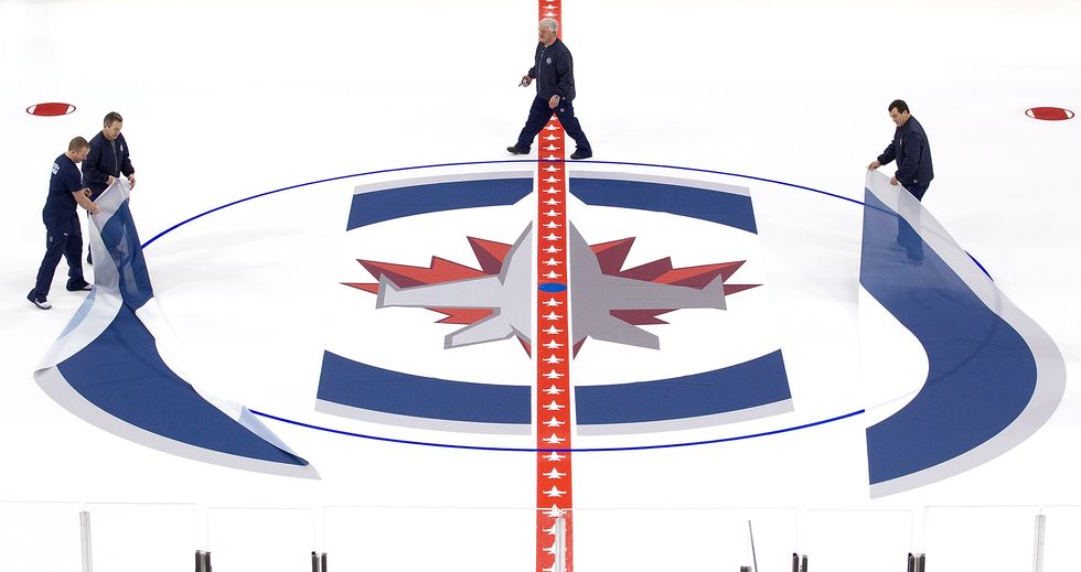 winnipeg jets install logo and lines in mts centre ice
