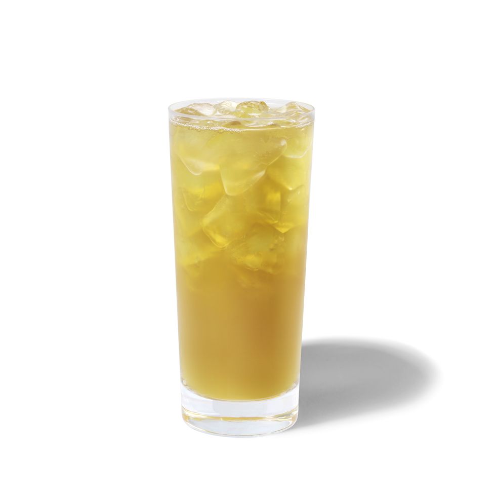 iced green tea lemonade from starbucks pictured in a glass with ice