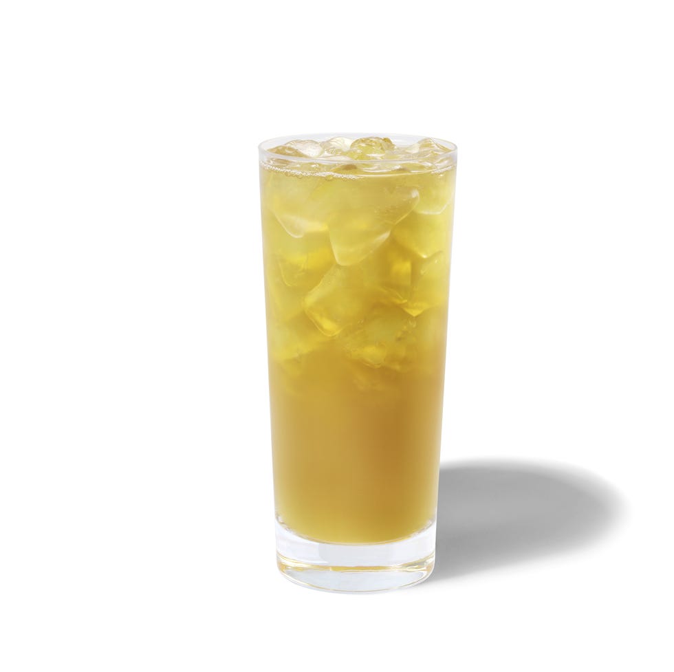 iced green tea lemonade from starbucks pictured in a glass with ice