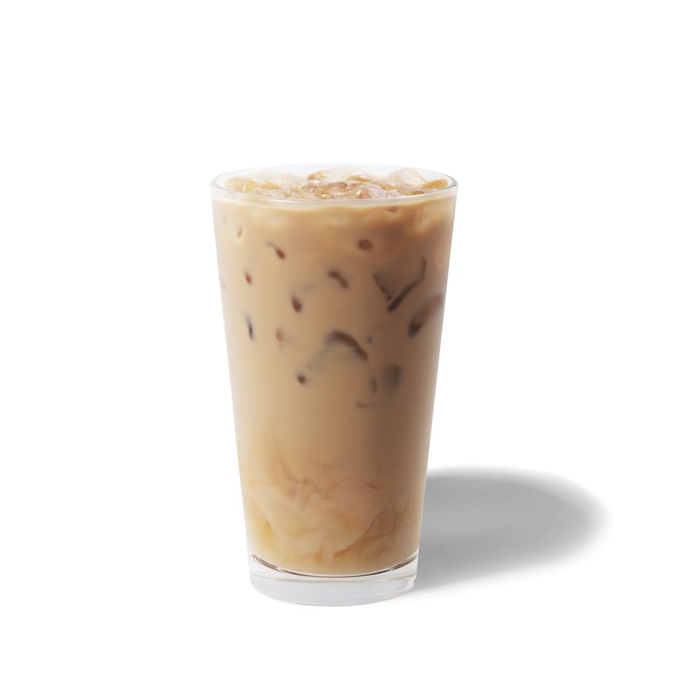 shot of a starbucks iced latte, in a glass with ice
