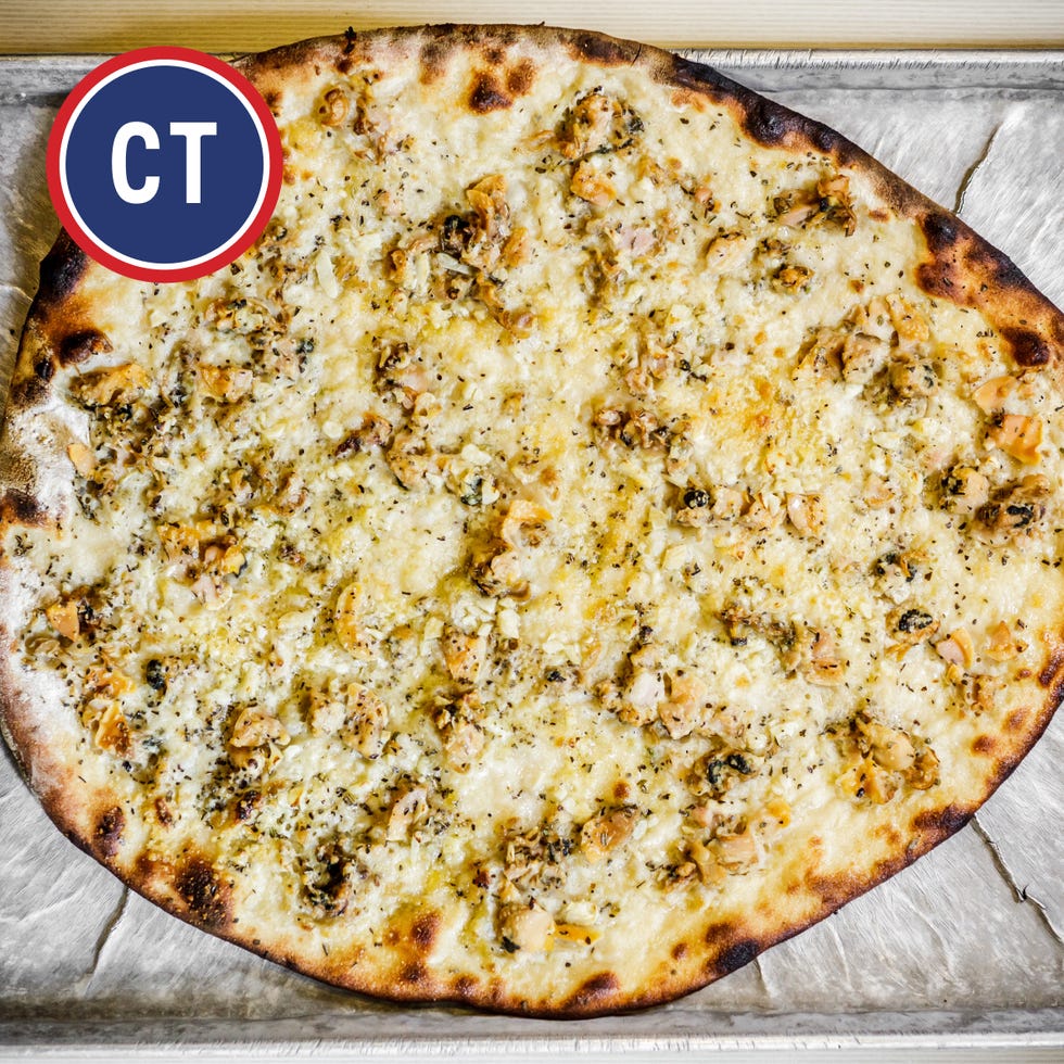 large cheese and chicken pizza with a logo