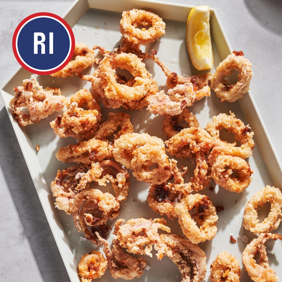 plate of fried calamari with a lemon wedge