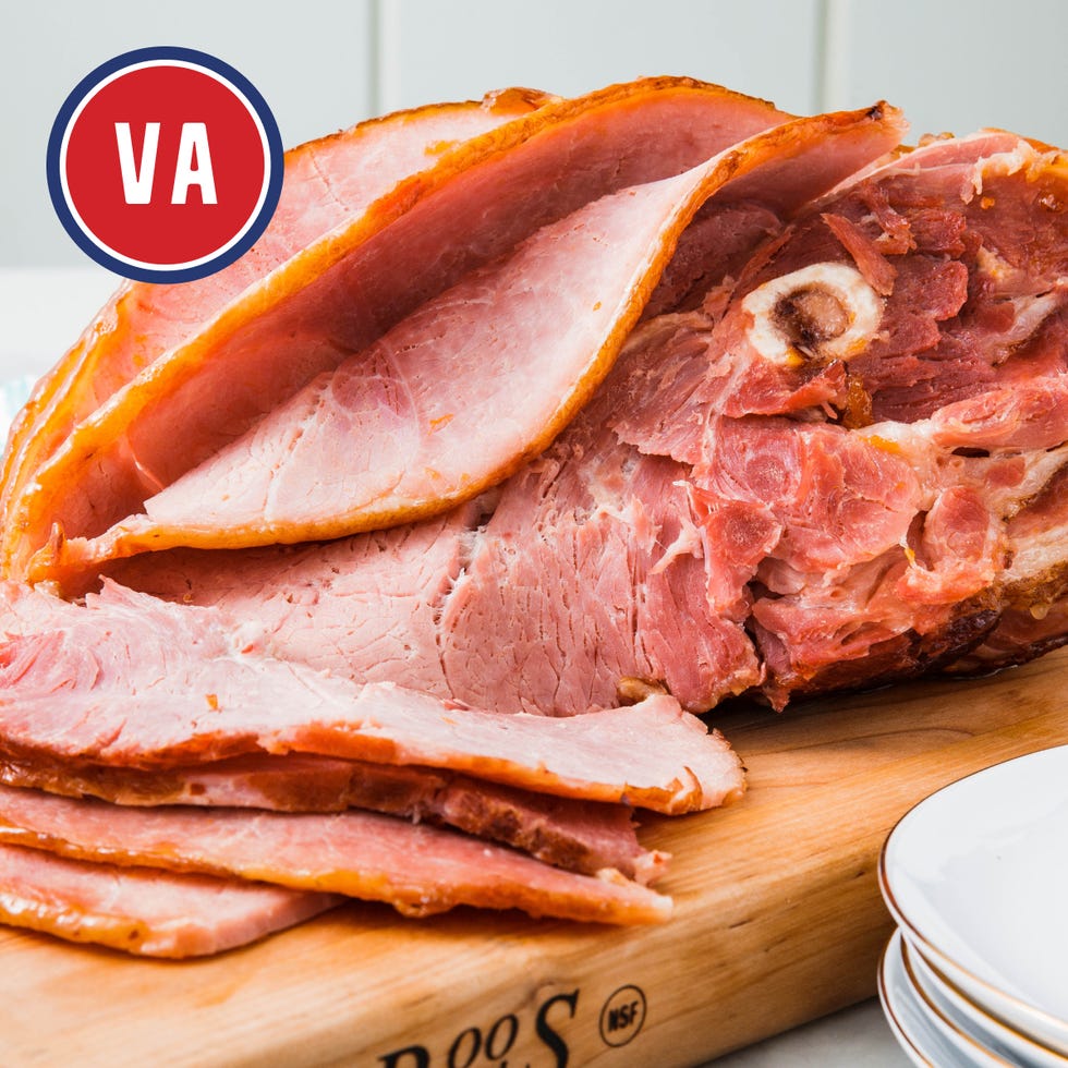 sliced virginia ham on a wooden cutting board