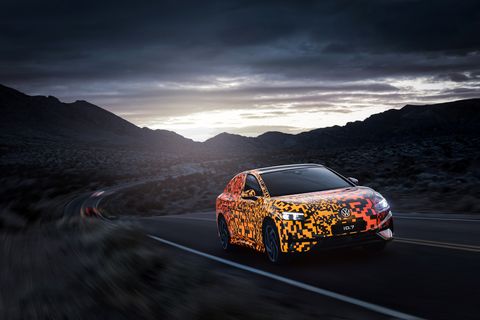 volkswagen id7 sedan with electroluminescent camouflage driving