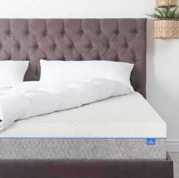bed with sheets turned up to show mattress