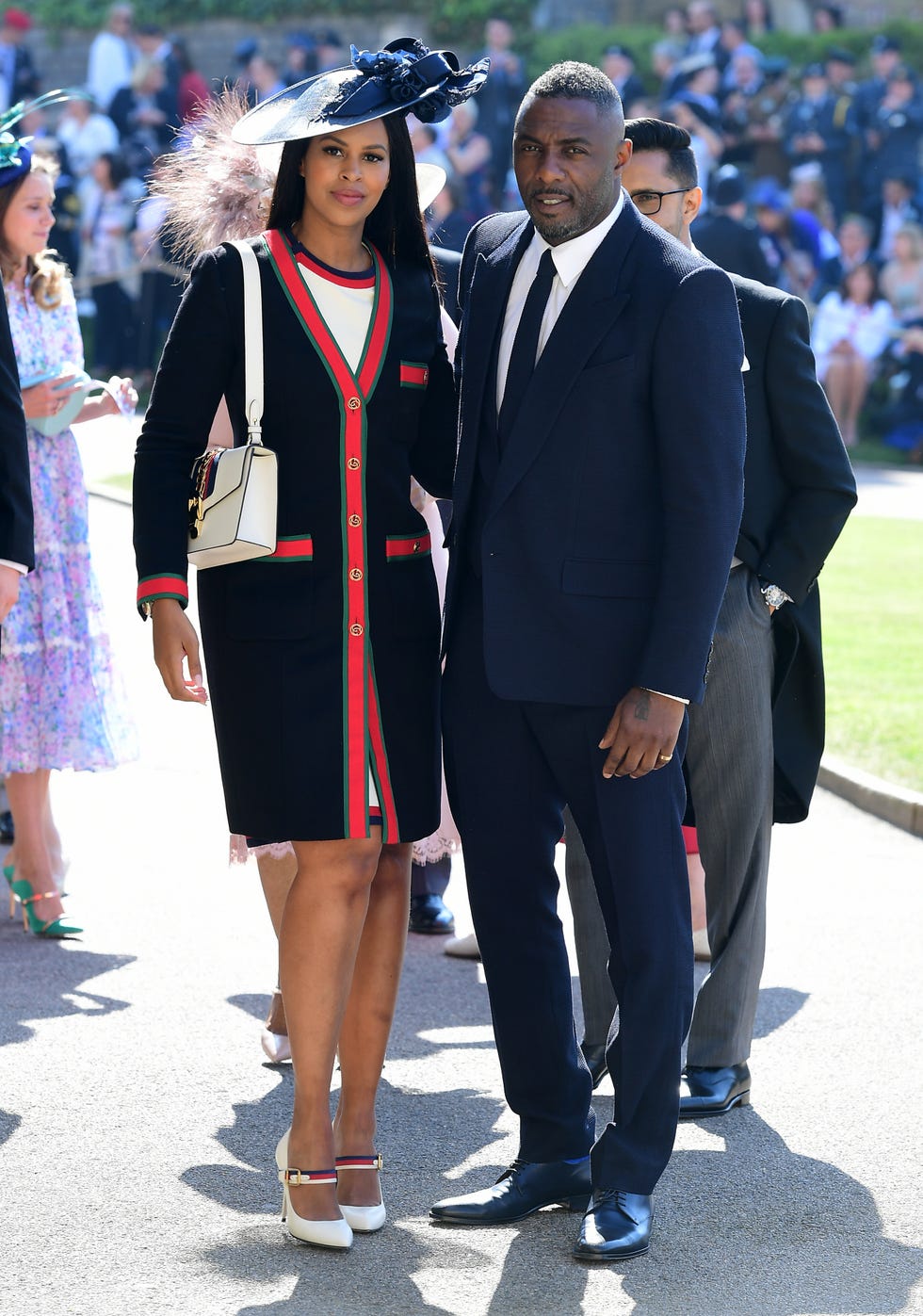 Fashion, Uniform, Street fashion, Event, Suit, Headgear, Footwear, Outerwear, Dress, Formal wear, 