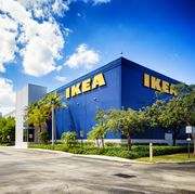 corner view of the ikea furniture store in sunrise florida near fort lauderdale on a mostly sunny winter day the image features the typical blue store with the yellow logo on its wall
