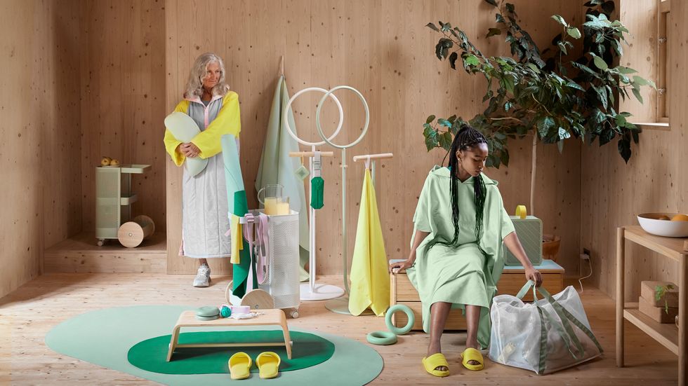 two women dressed in robes sat in room filled with ikea fitness collection