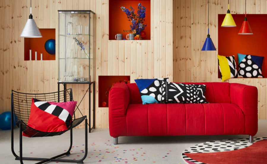 Living room, Couch, Furniture, Interior design, Room, Red, Sofa bed, Wall, Orange, Lighting, 