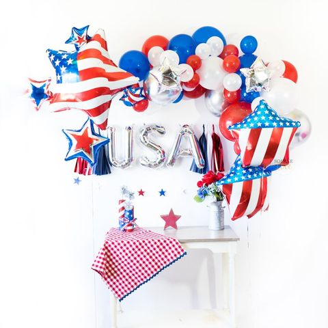 Flag, Font, Independence day, Party supply, Wheel, Holiday ornament, Confectionery, 