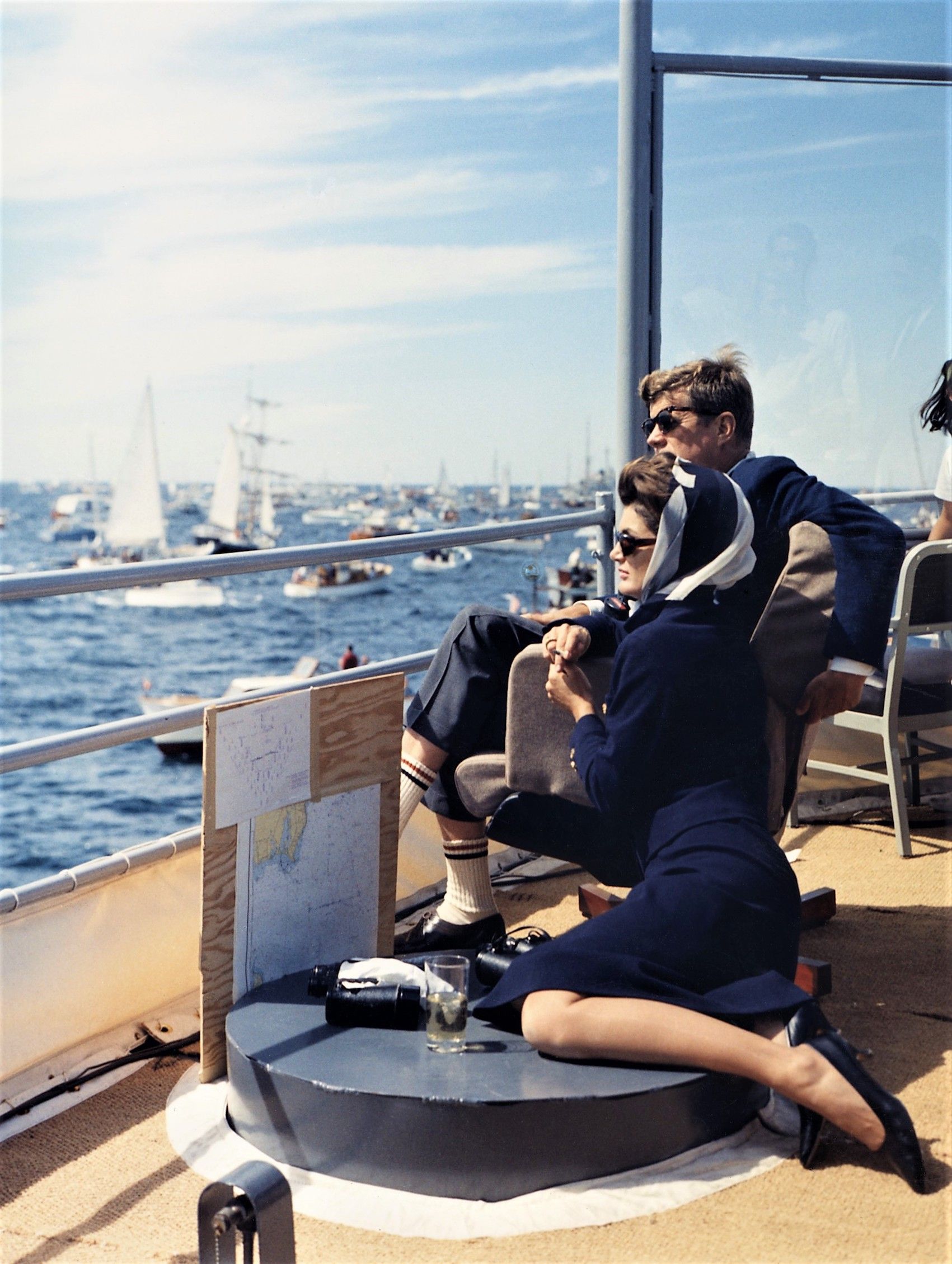 President and Jacqueline Kennedy watch the America\'s Cup Race from the Deck of the USS Joseph P. Kennedy, Jr. The race was off Newport, Rhode Island, on Sept. 15, 1962