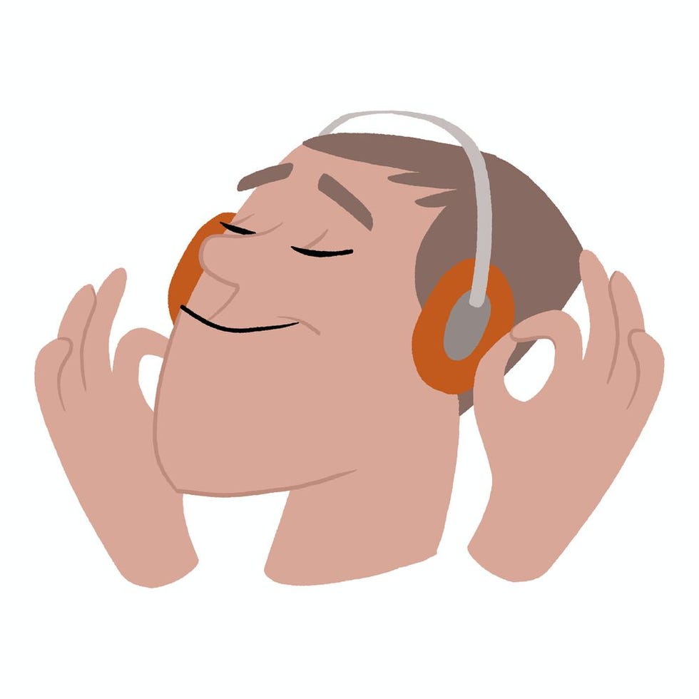 person enjoying music with headphones