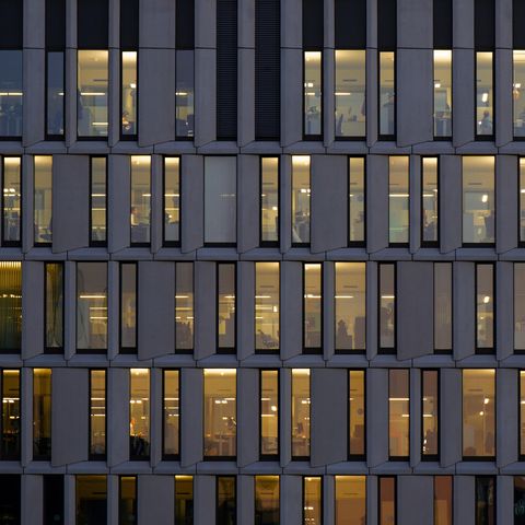 illuminated office workplaces in the mitte district, berlin, germany