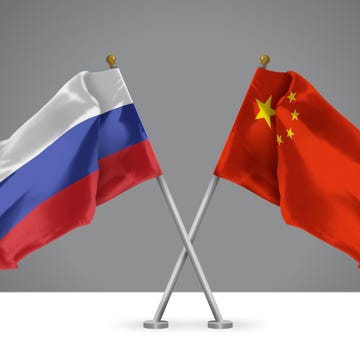 3d illustration of two crossed flags of china and russia