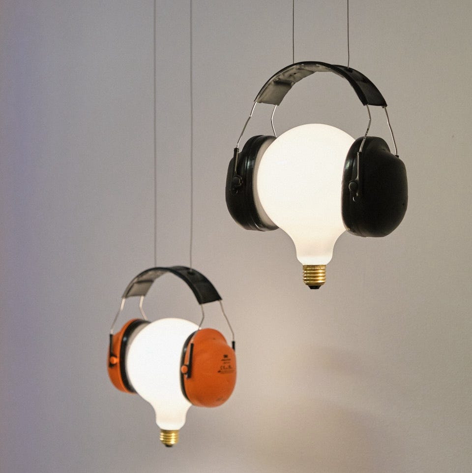Ingo Maurer Shhhh lamps bulbs wearing headphones