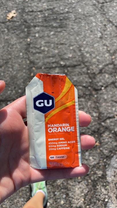 mandarin orange flavored energy gel packet from gu being tested by cavallo