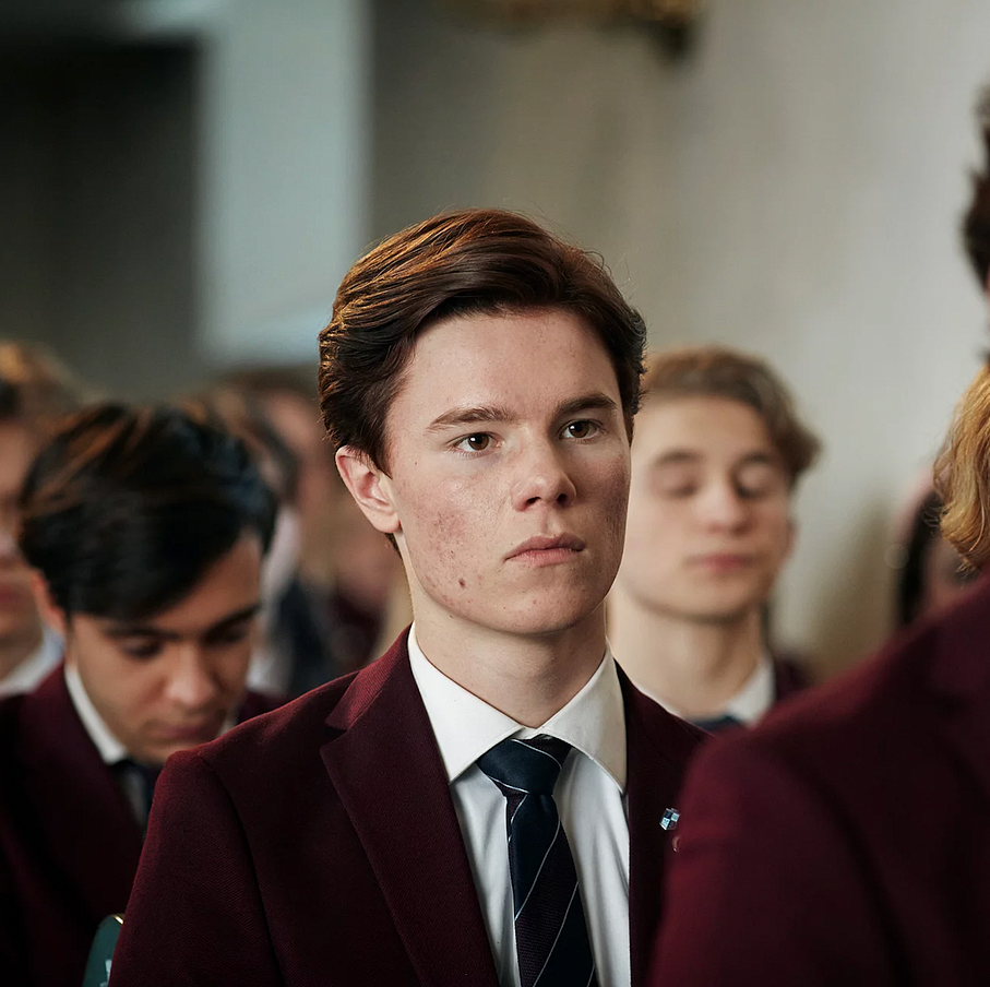 Young Royals Episode Still group of students in formal attire participating in a ceremony