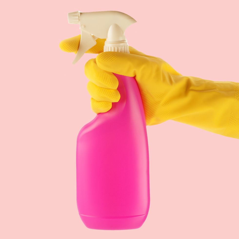 pink spray bottle on pink background