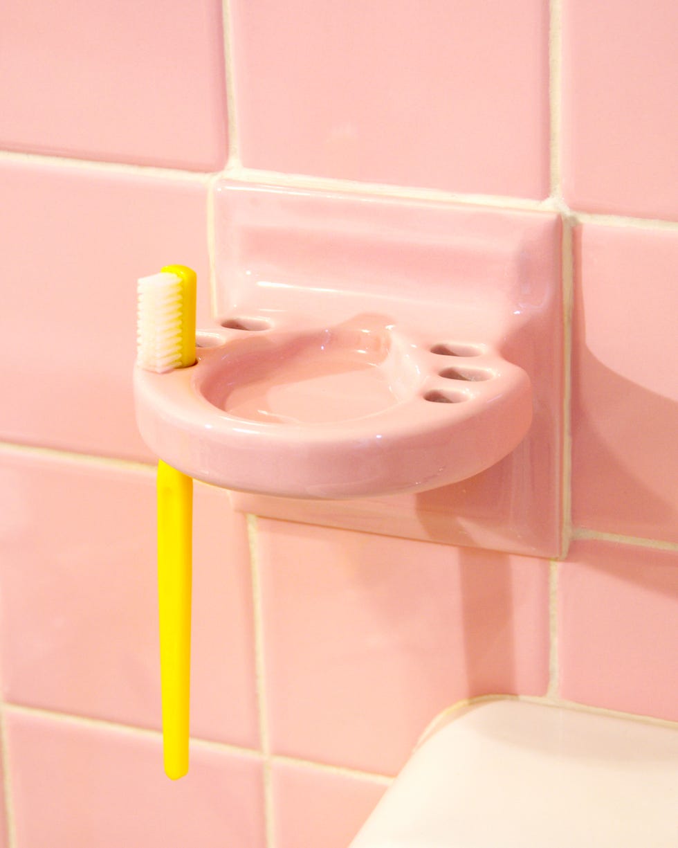 pink bathroom and yellow toothbrush